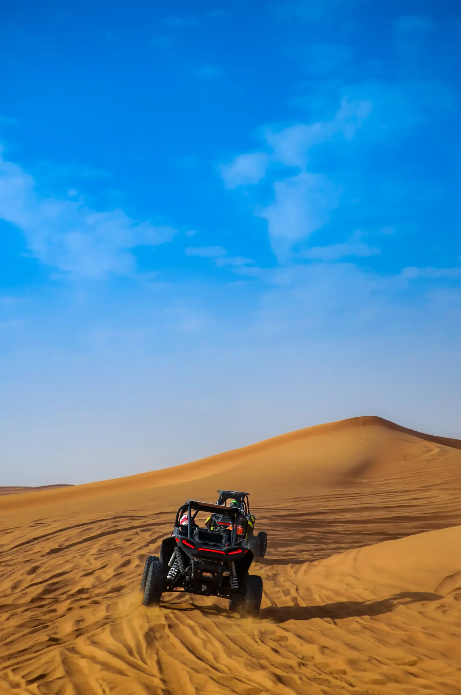 Can-Am X3 4-seater buggy on the red dunes during a private buggy tour in Dubai