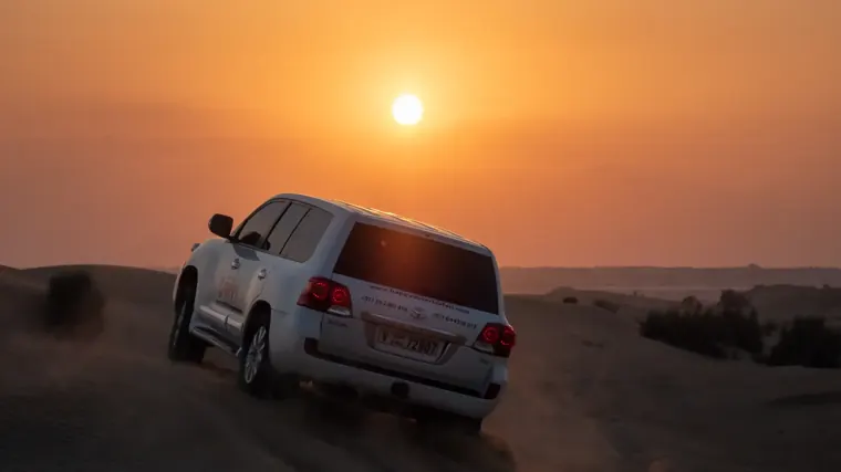 Private 4x4 on the Dubai dunes at sunset on a private desert safari